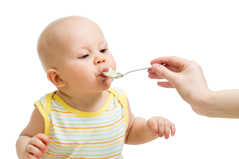 Baby eating from a spoon