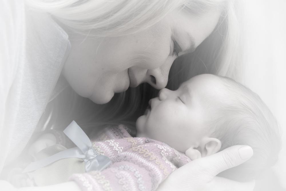 Baby asleep with mum